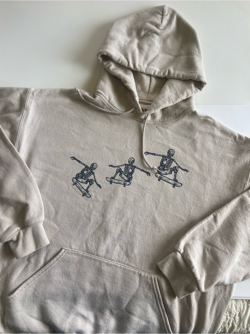 Artist Union Clothing Co. Beige Pullover Hoodie with Navy Skeleton Skate Graphic